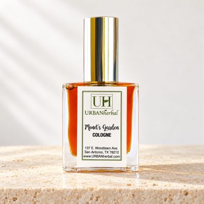 URBANherbal Monet’s Garden cologne on warm ivory stone