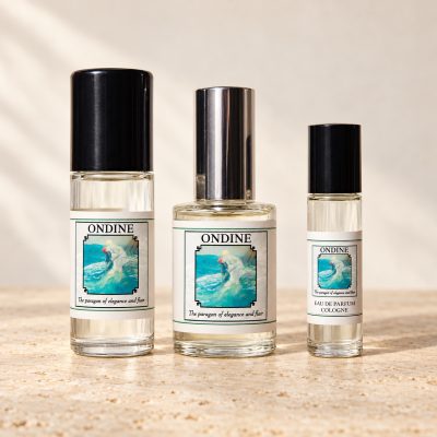 Three Ondine fragrance bottles on warm ivory stone